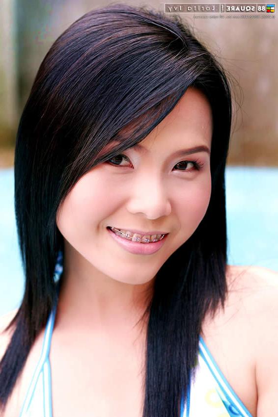15P Adorable japanese teen posing by the pool