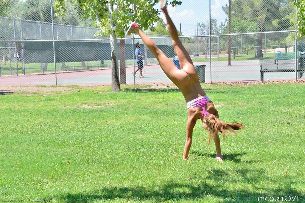 15P Cute gymnast does naked backflips by the tennis court