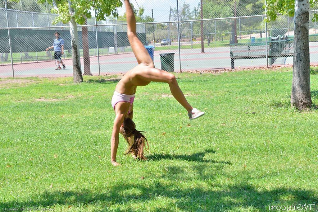 15P Cute gymnast does naked backflips by the tennis court