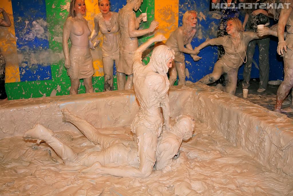 15P Adorable lesbians enjoy wrestling in a tub of dirt and mud