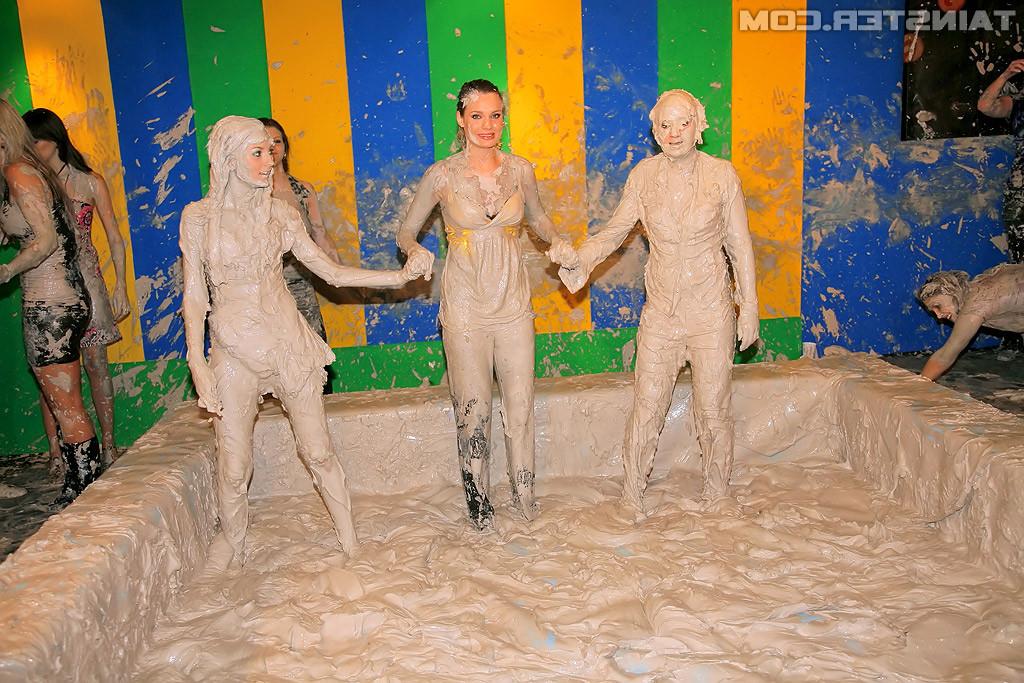 15P Adorable lesbians enjoy wrestling in a tub of dirt and mud