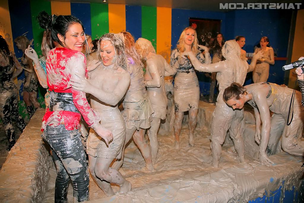 15P Adorable lesbians enjoy wrestling in a tub of dirt and mud