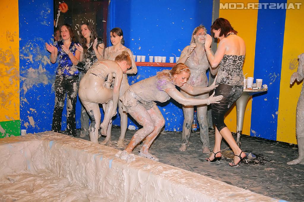 15P Adorable lesbians enjoy wrestling in a tub of dirt and mud