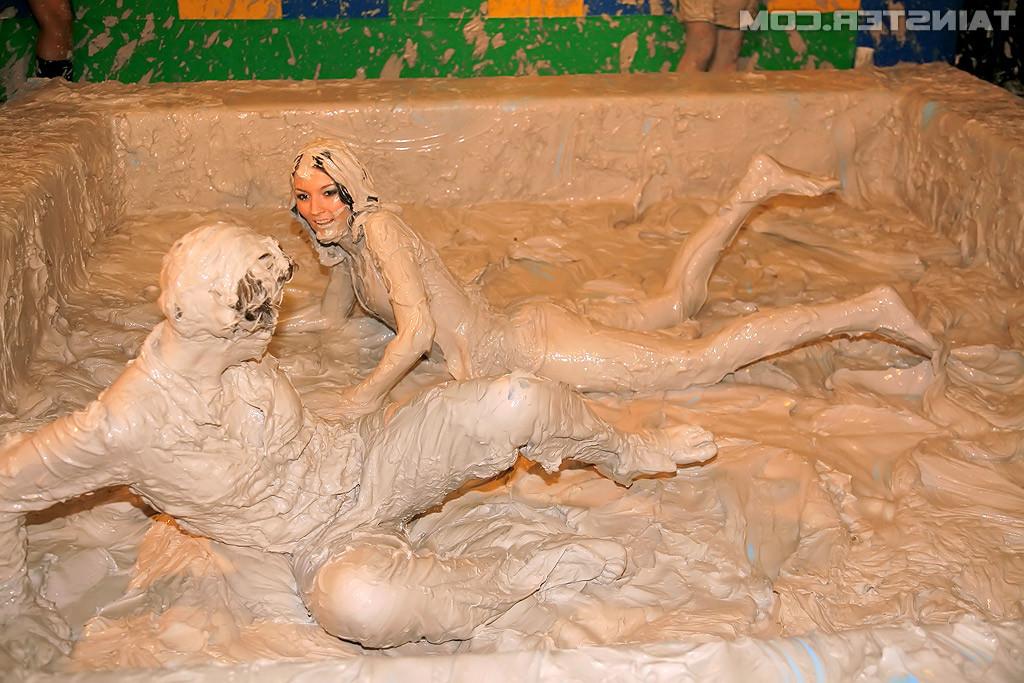 15P Adorable lesbians enjoy wrestling in a tub of dirt and mud
