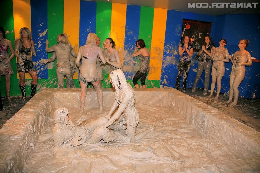 15P Adorable lesbians enjoy wrestling in a tub of dirt and mud