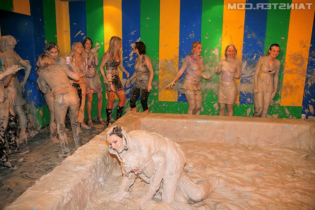 15P Adorable lesbians enjoy wrestling in a tub of dirt and mud