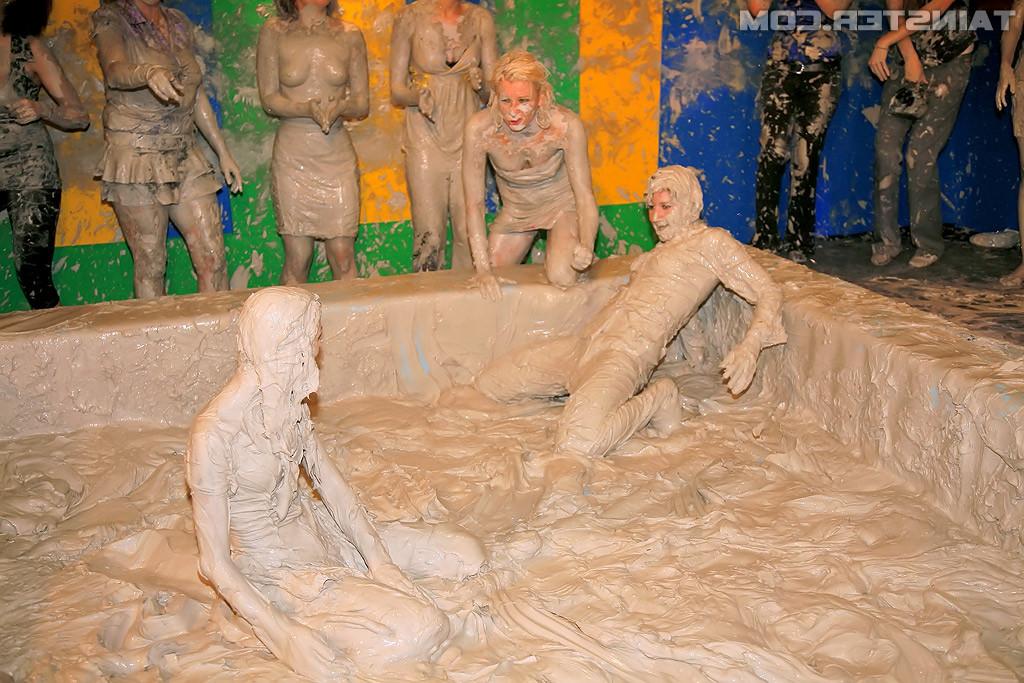 15P Adorable lesbians enjoy wrestling in a tub of dirt and mud