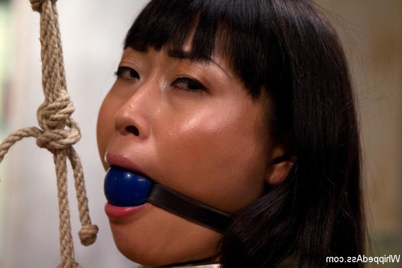 15P Adroable Asian sub slut is spanked, tit tortured, tied spread eagle and strap-on