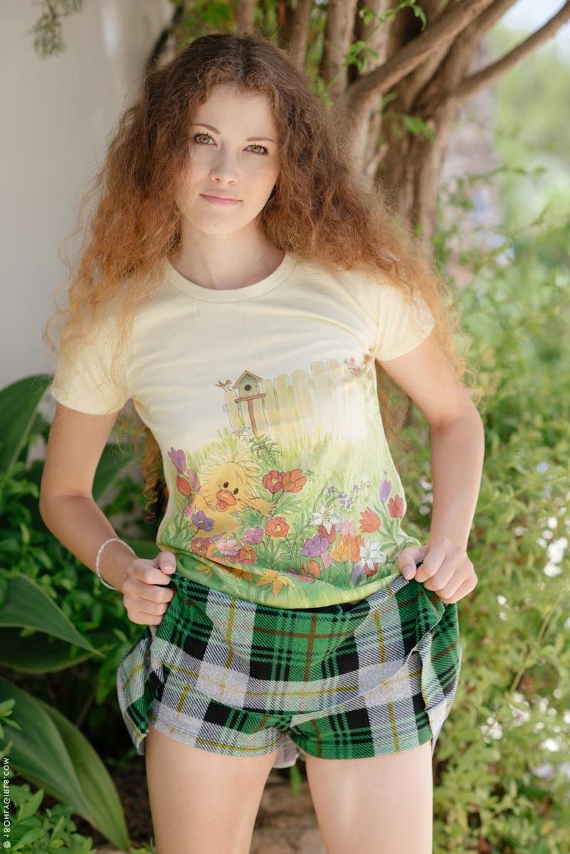 15P Lovely teen takes off her skirt in the backyard