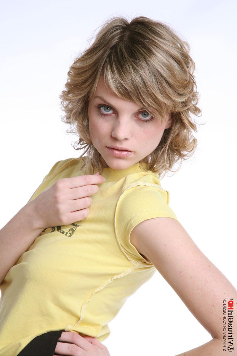 16P Adorable blonde Maggie stripping in a short skirt