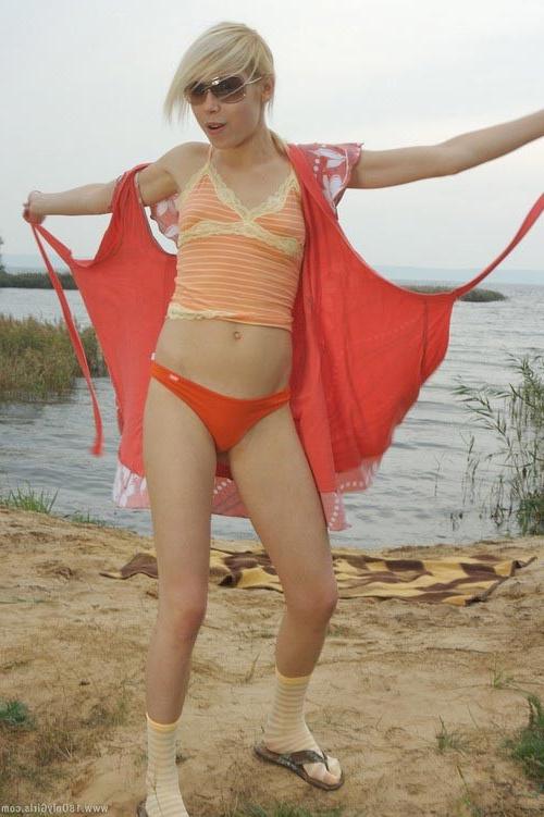 16P Adorable small titted blonde teenie posing naked on the beach
