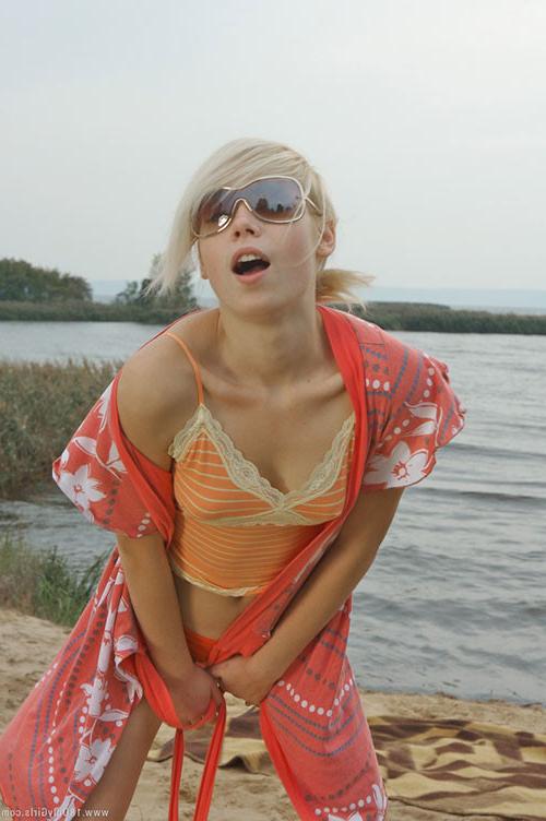 16P Adorable small titted blonde teenie posing naked on the beach