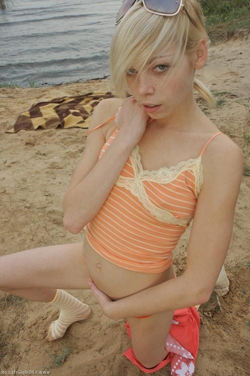 16P Adorable small titted blonde teenie posing naked on the beach