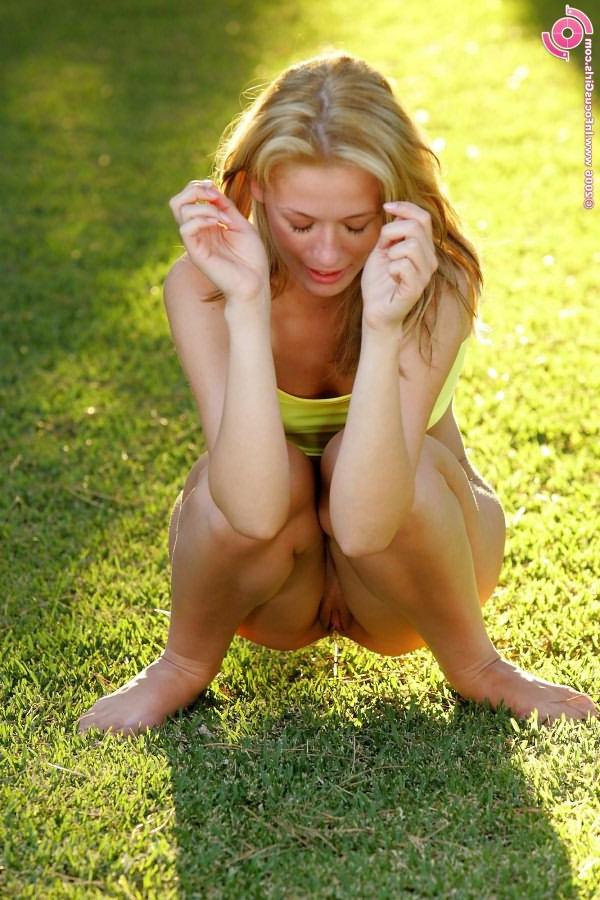 16P Adorable blonde teen posing and doing bizarre things outdoor