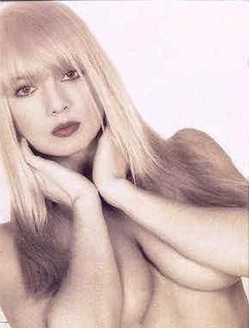 15P Adorable babe Traci Lords showing her big nude boobs