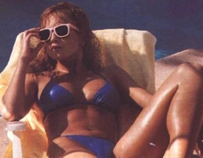 15P Adorable babe Traci Lords showing her big nude boobs