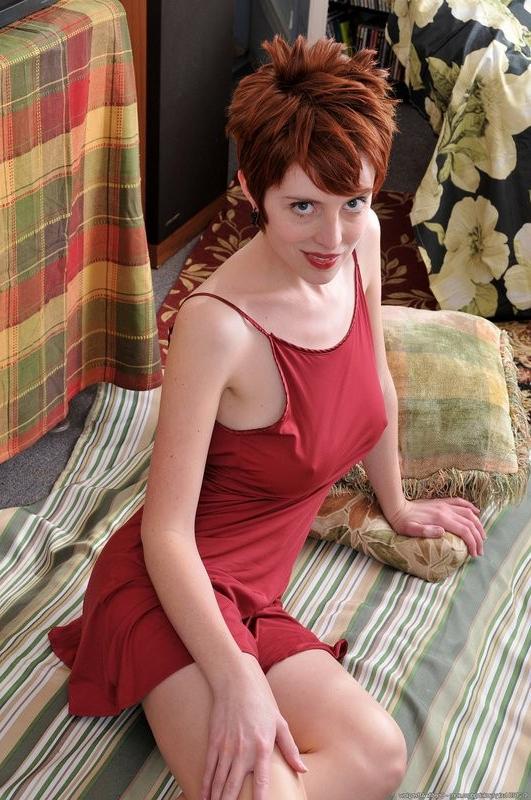 15P lovely redhead Ryanne exposes her lucious pussy