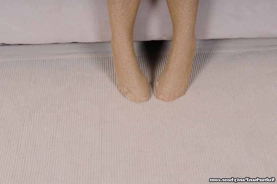 15P Adorable brunette teen models in her shiny pantyhose