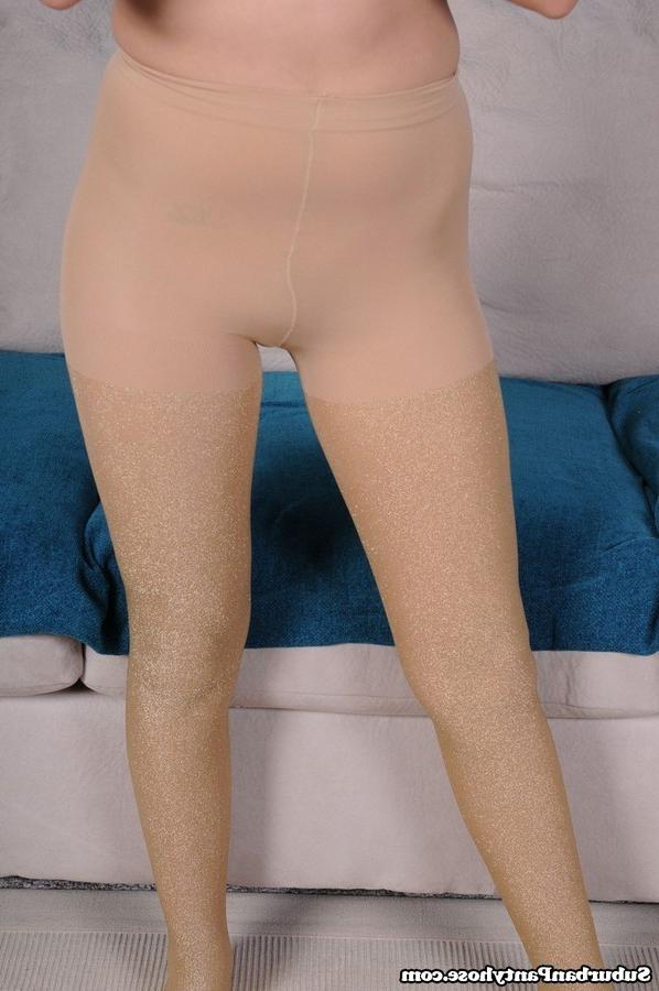 15P Adorable brunette teen models in her shiny pantyhose