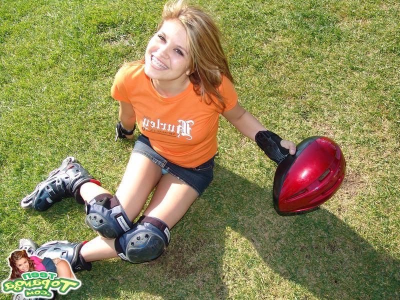 15P Adorable eighteen year old rollerblading and flashing outdoors