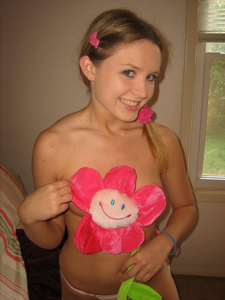 15P Playful blonde teen with tiny tits removes panties