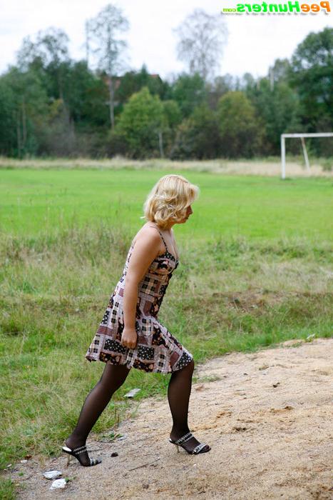 16P Adorable blonde hoochie caught pissing alfresco