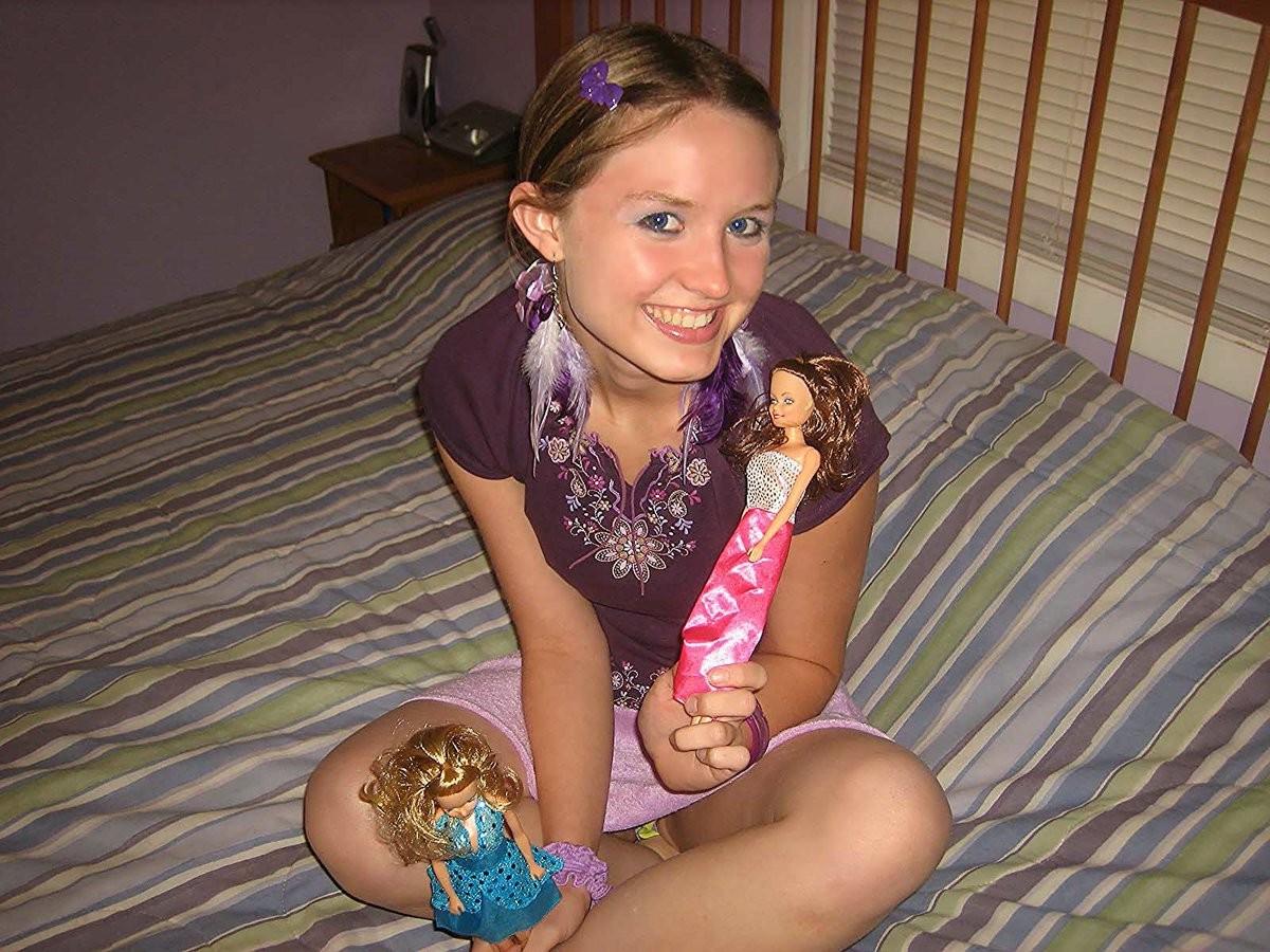 18P Silly teen getting nude and having fun with barbie