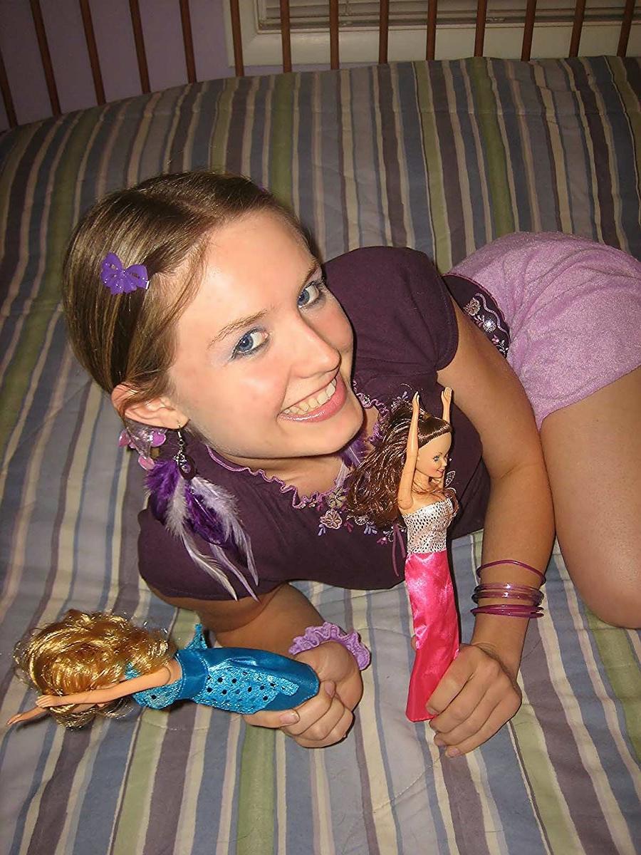 18P Silly teen getting nude and having fun with barbie