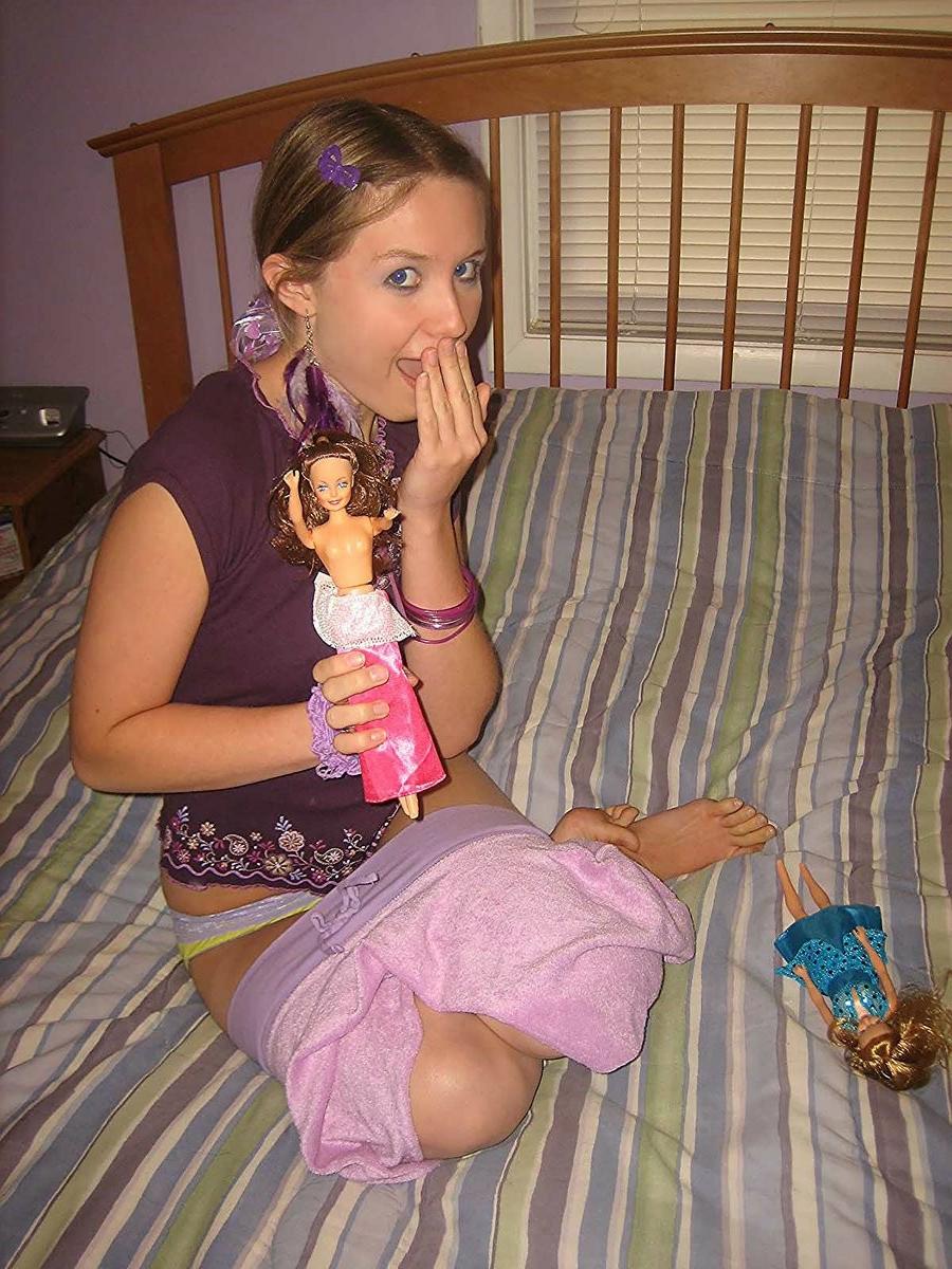 18P Silly teen getting nude and having fun with barbie