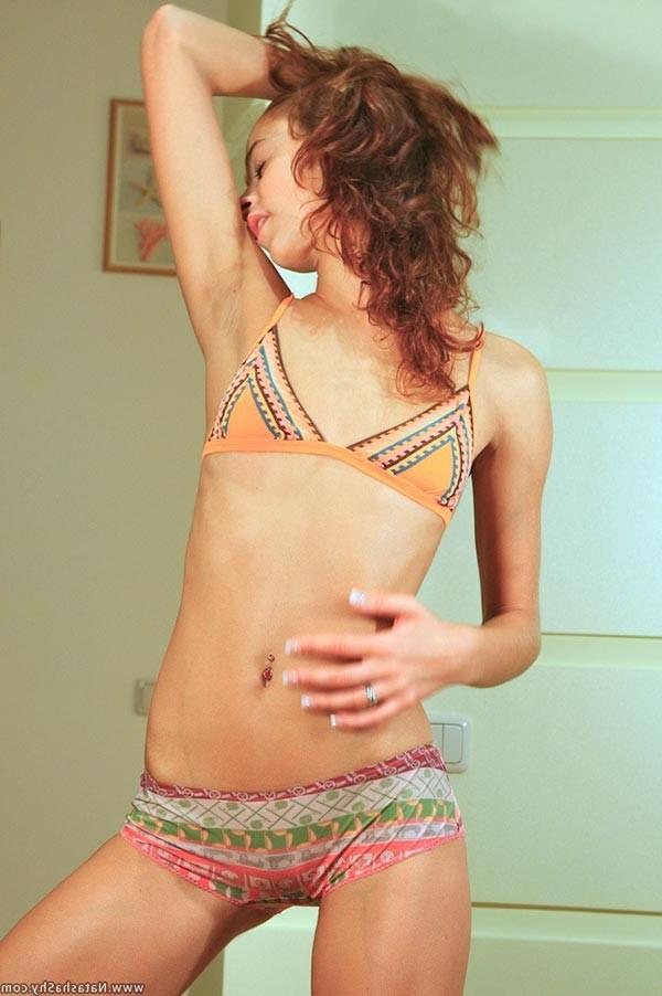 17P Lovely redhead teen stripping in front of the camera