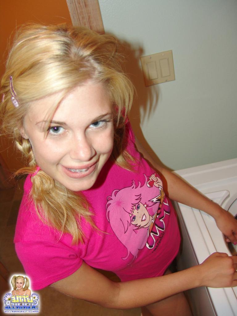 16P An adorable teenie in pink outfit strips down slow