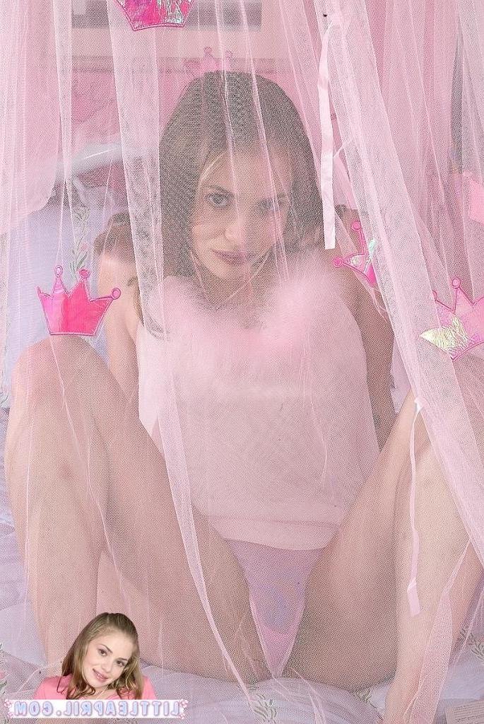 16P An adorable teenie in pink spreading her pussy