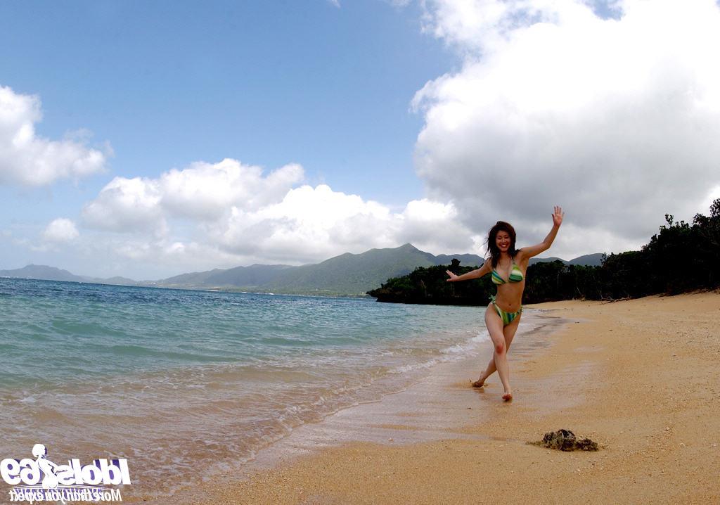 16P Busty asian babe Adusa Kyono slipping off her bikini outdoor