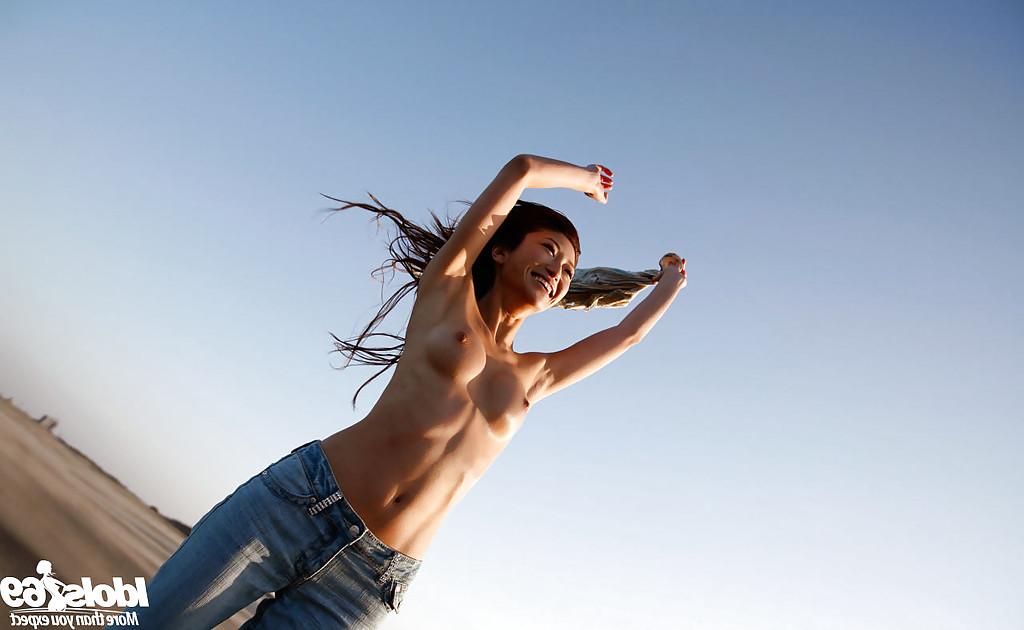 14P Lovely asian babe Yu Satome uncovering her big tits outdoor