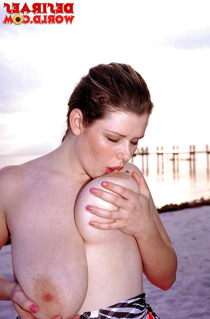 16P Plump pornstar Desirae demonstrating massive saggy boobs outdoors on beach