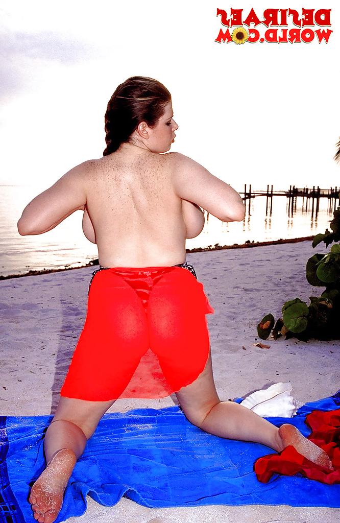 16P Plump pornstar Desirae demonstrating massive saggy boobs outdoors on beach
