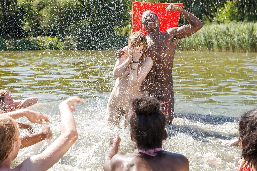 16P Amateur European boys and girls wrestle naked outdoors at the beach