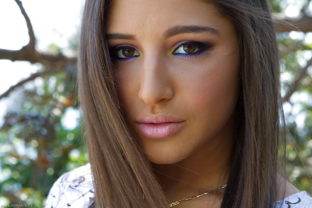 15P Beautiful teen babe Abella Danger strutting in yoga pants outdoors