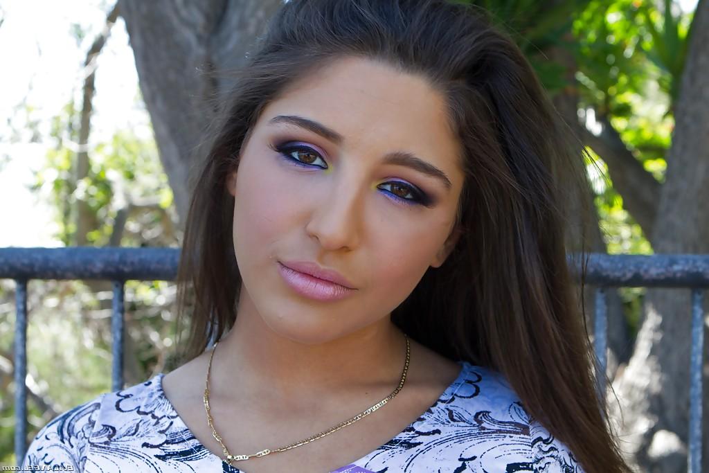 15P Beautiful teen babe Abella Danger strutting in yoga pants outdoors