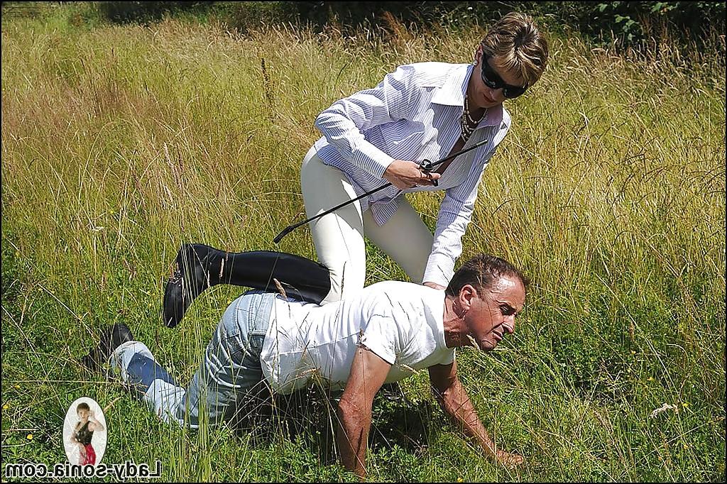 15P Seductive mature femdom playing with her human pet outdoor