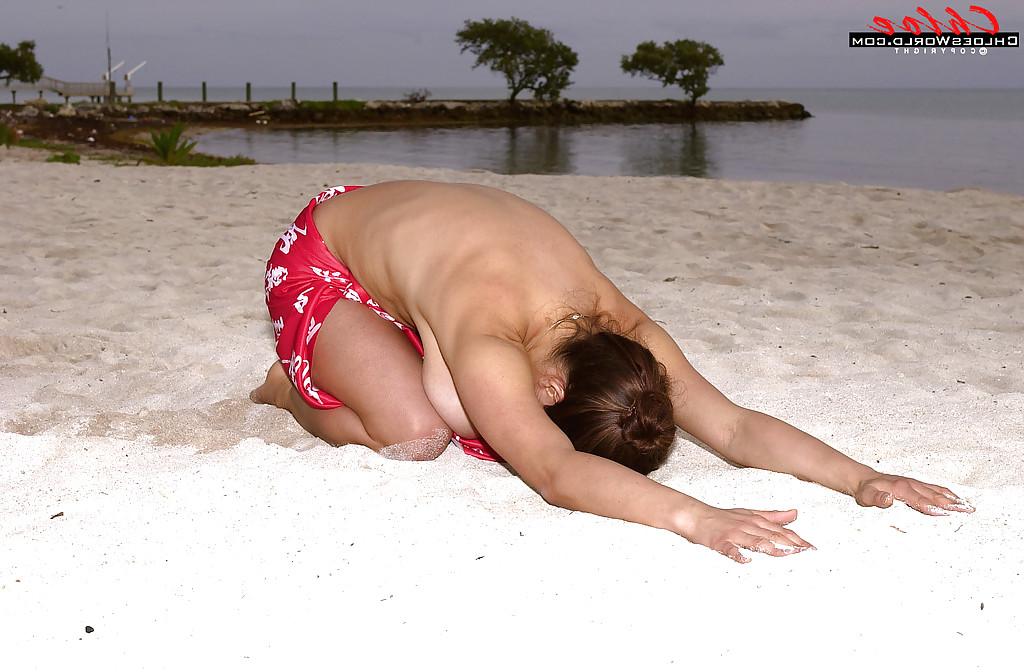 16P Buxom French MILF Chloe Vevrier spreading hairy pussy outdoors on beach
