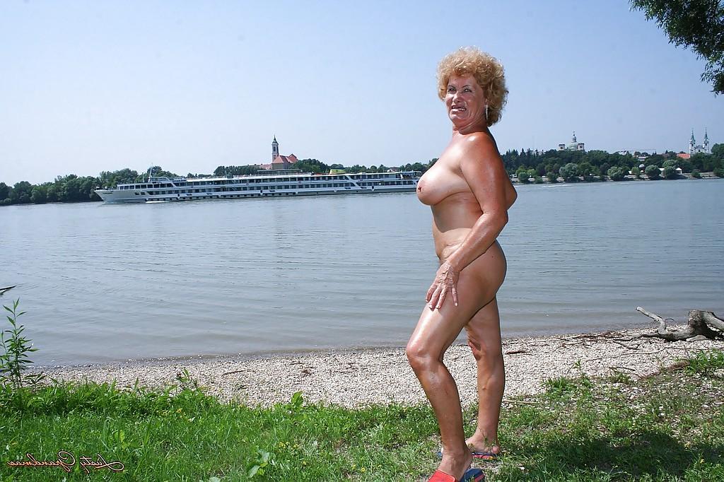 16P Fatty granny with big boobs stripping off her clothes outdoor