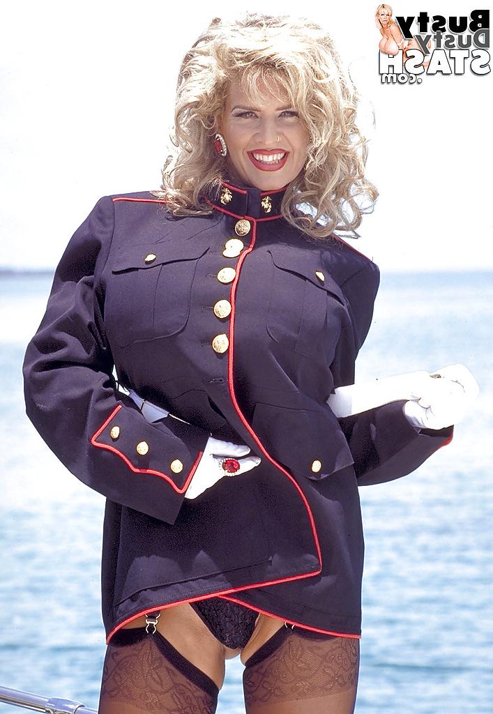 16P Older blonde babe Busty Dusty freeing huge boobs from uniform outdoors