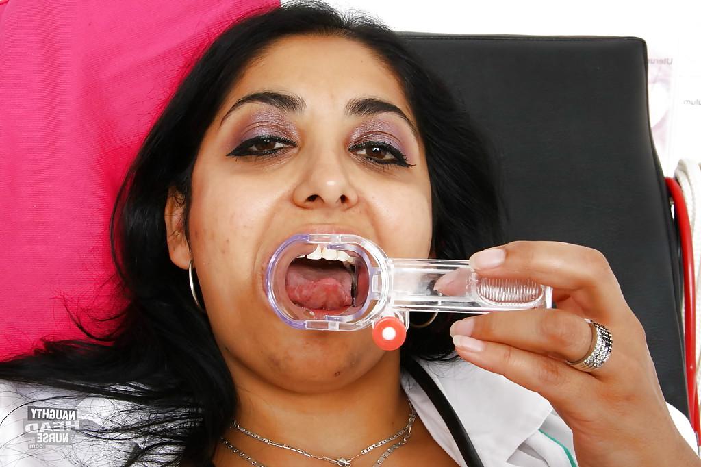 16P Aged Indian woman Alice using a speculum on her pussy in hospital