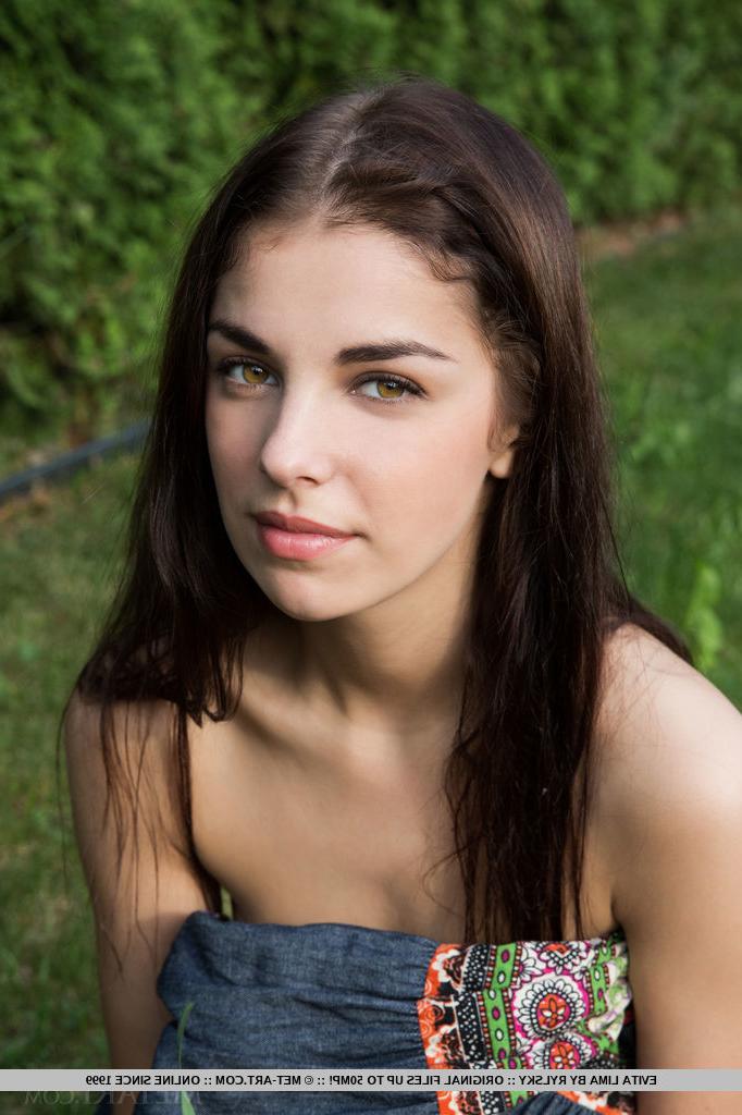 18P Pretty brunette Evita Lima displaying full teen breasts and cunt outdoors
