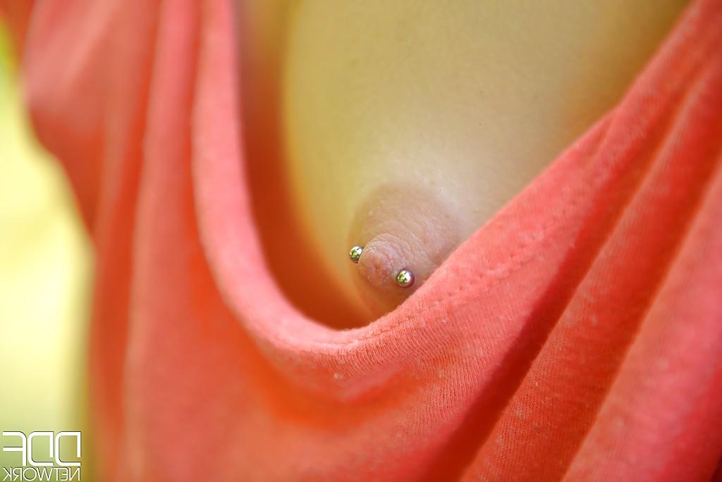 16P Cute Euro chick Amber Nevada bares nice pierced nipples outdoors
