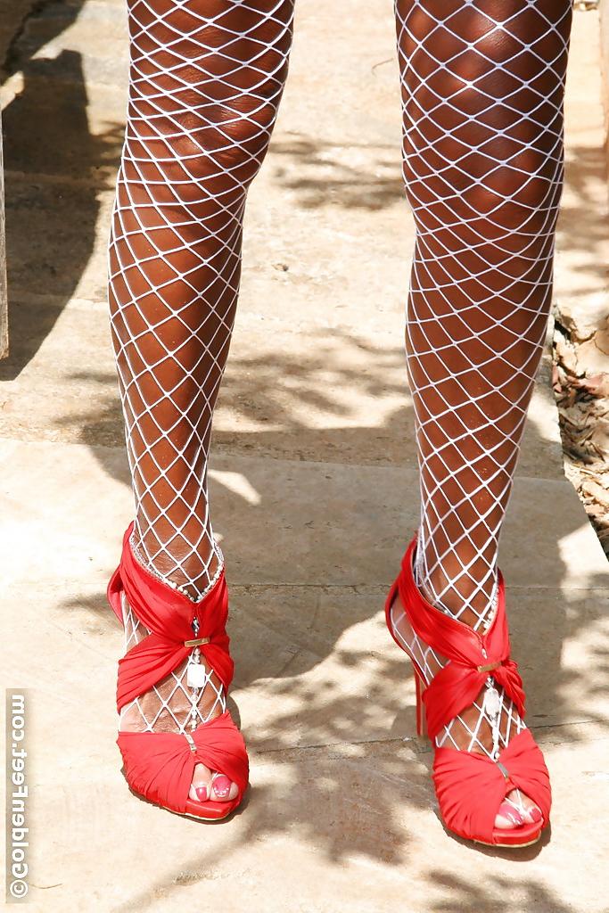 12P Naughty mature UK woman Lady Sarah modeling topless outdoors in fishnets