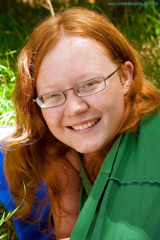 16P Ugly redhead chick in glasses strips naked outdoors for pussy spreading