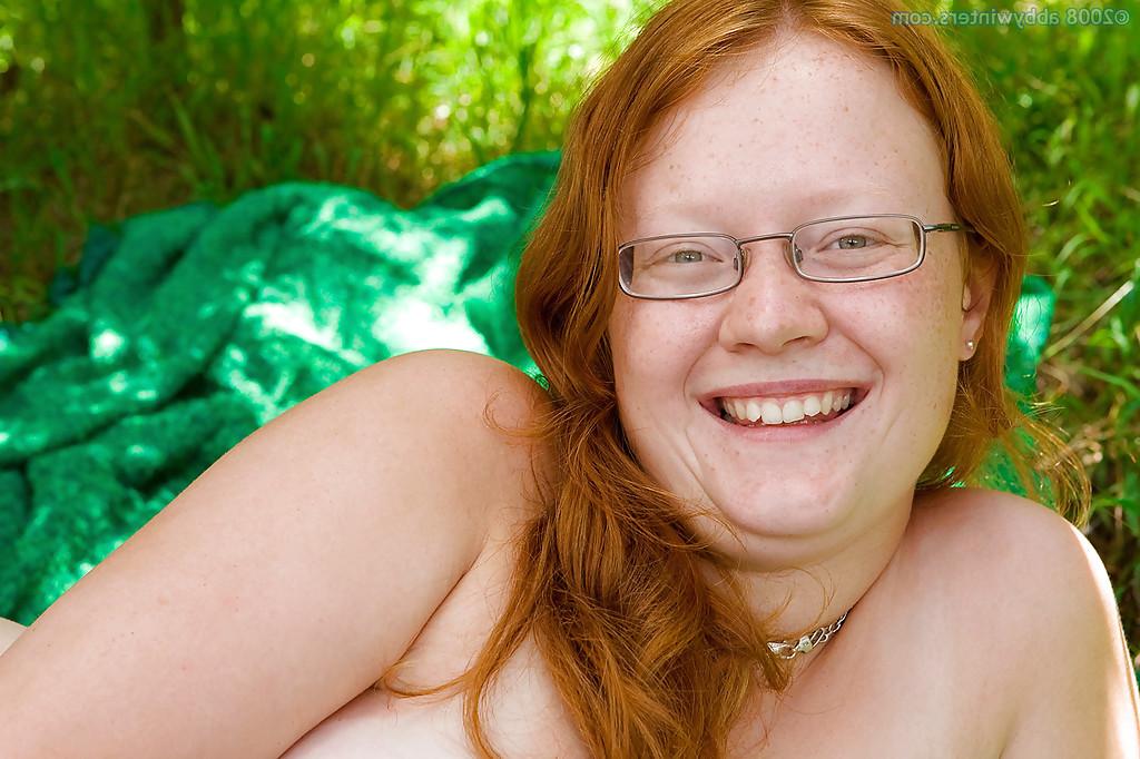 16P Ugly redhead chick in glasses strips naked outdoors for pussy spreading