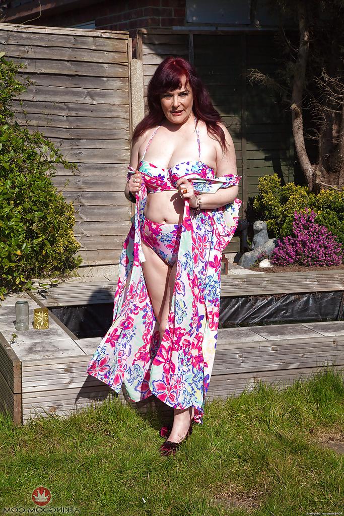 16P Older fatty Christina X pulling down bikini bottoms outdoors